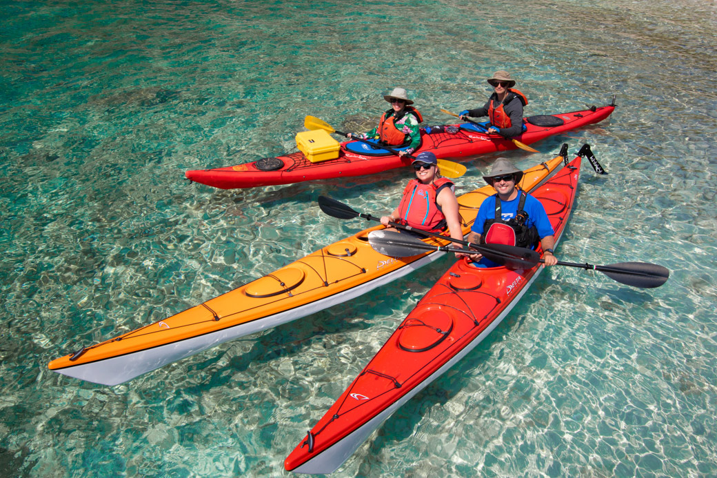 Croatia kayaking trip kayakers in clear water.