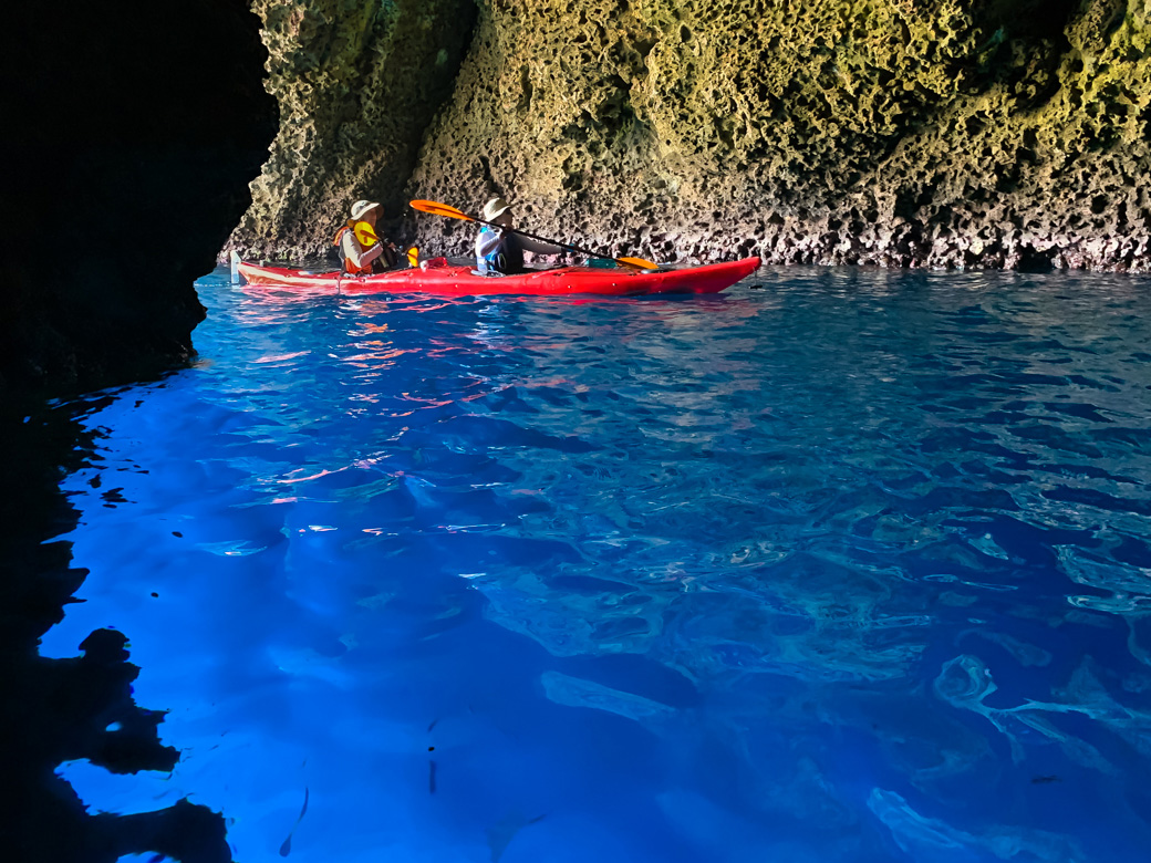 Kayakers in Sea Cave near Taormina, Sicily 
