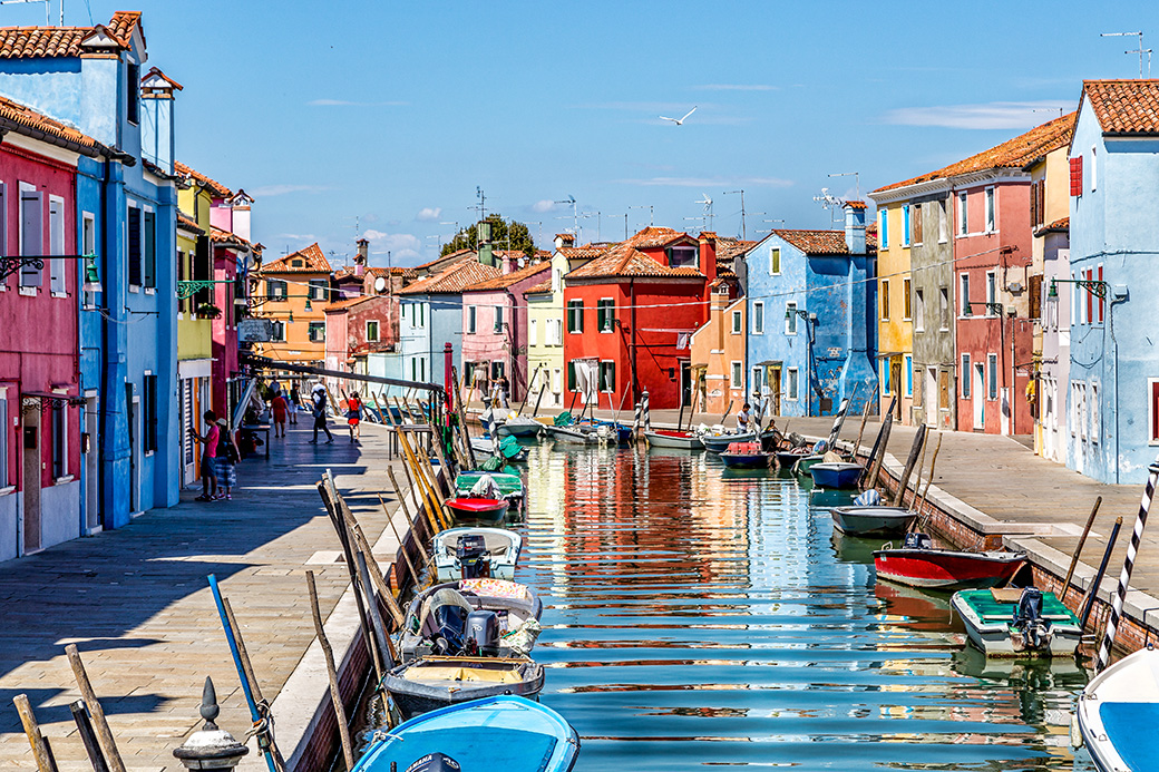 Canal reflections in colorful Burano island near Venice
