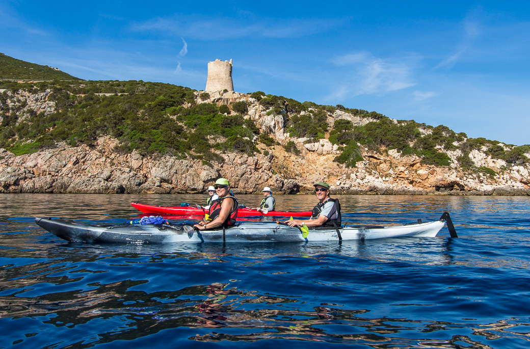 Paddling past an ancient Genovese tower on the way to Capa Caccia near Alghero