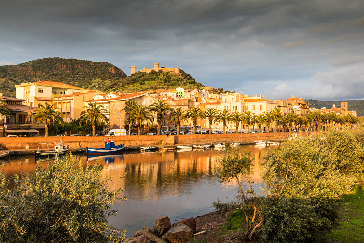 Sunset light on the town of Bosa and Malaspina Castle, kayaking Sardinia