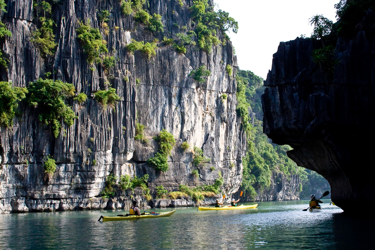 Kayaking Group Navigating the Islands of Halong Bay, Vietnam
